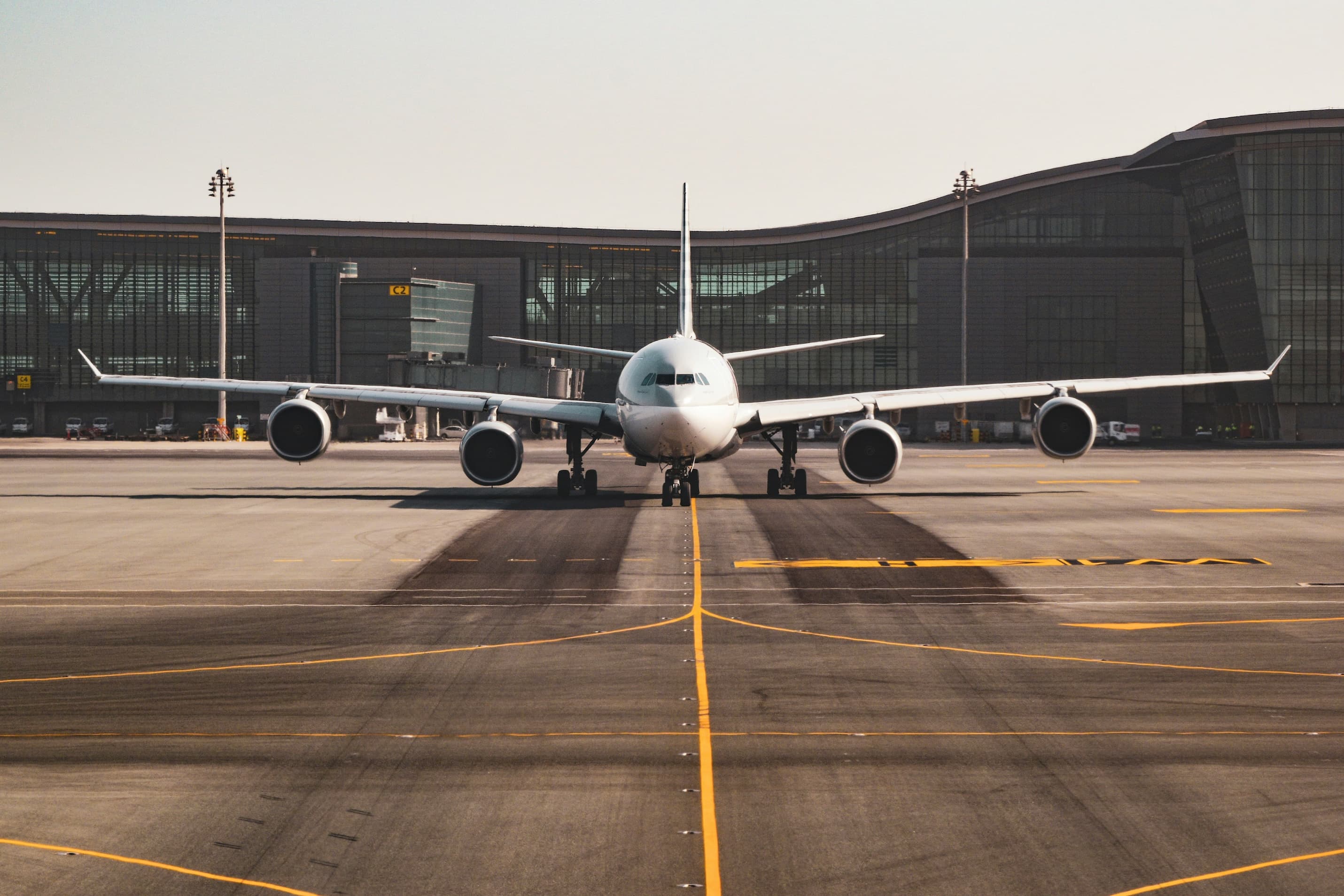 A plane preparing to leave an airport terminal